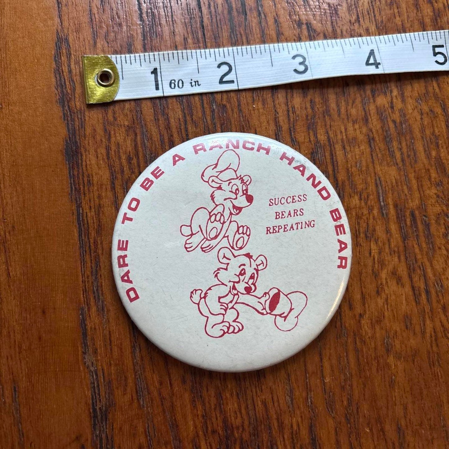 Vintage 80s USA dare to be a ranch hand bear western pin badge