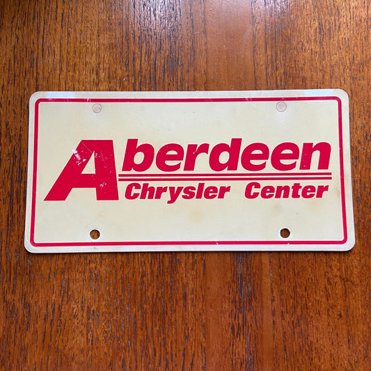 Vintage 90s USA Aberdeen Chrysler Center South Dakota automobile American license plate