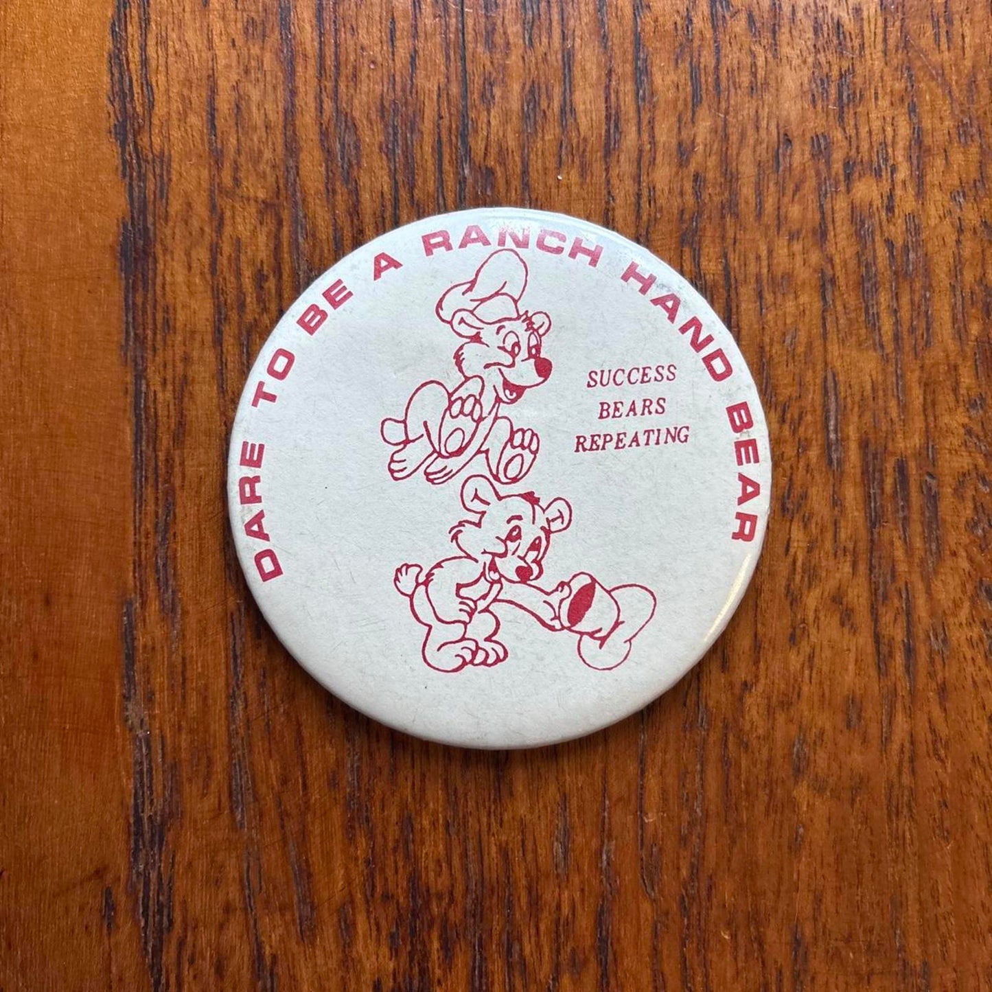 Vintage 80s USA dare to be a ranch hand bear western pin badge