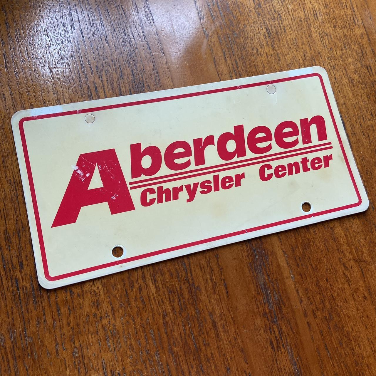 Vintage 90s USA Aberdeen Chrysler Center South Dakota automobile American license plate