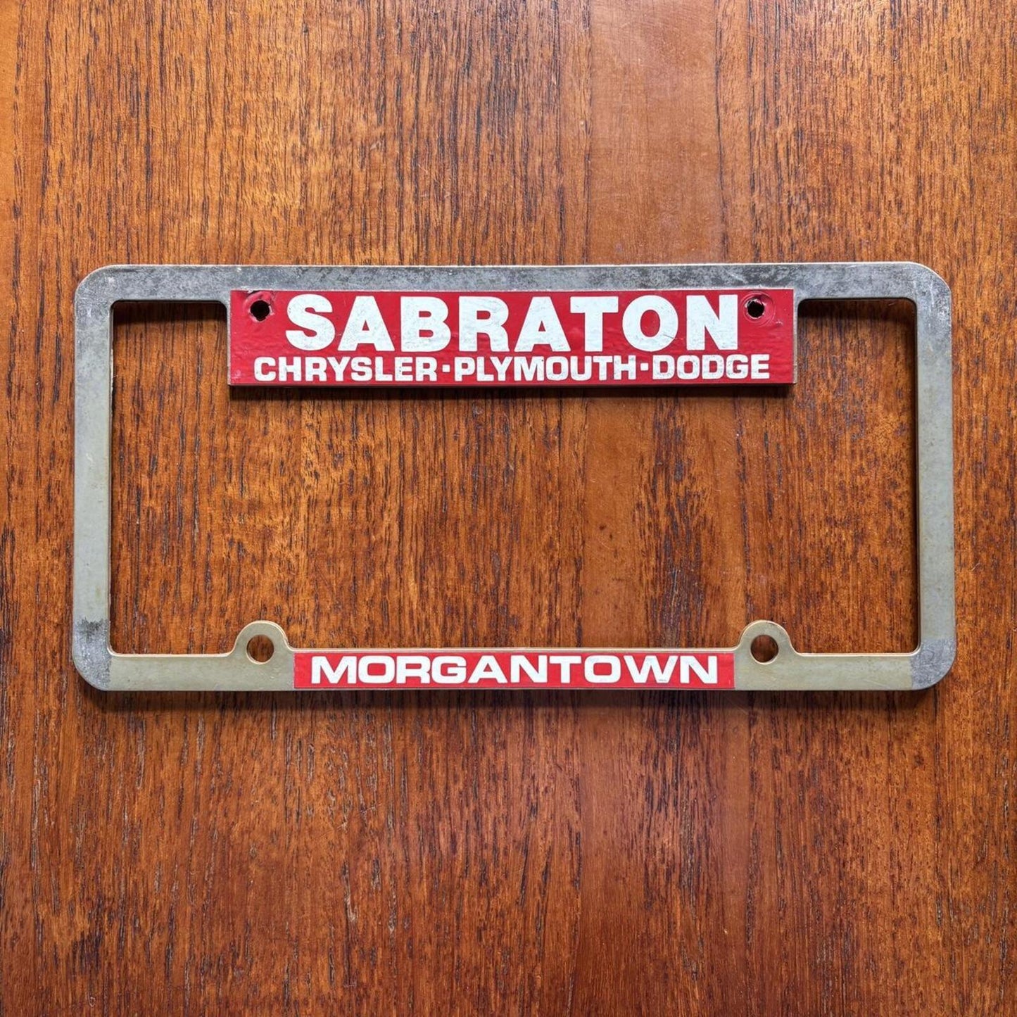 Vintage 90s Chrysler Dodge dealership West Virginia America license plate holder