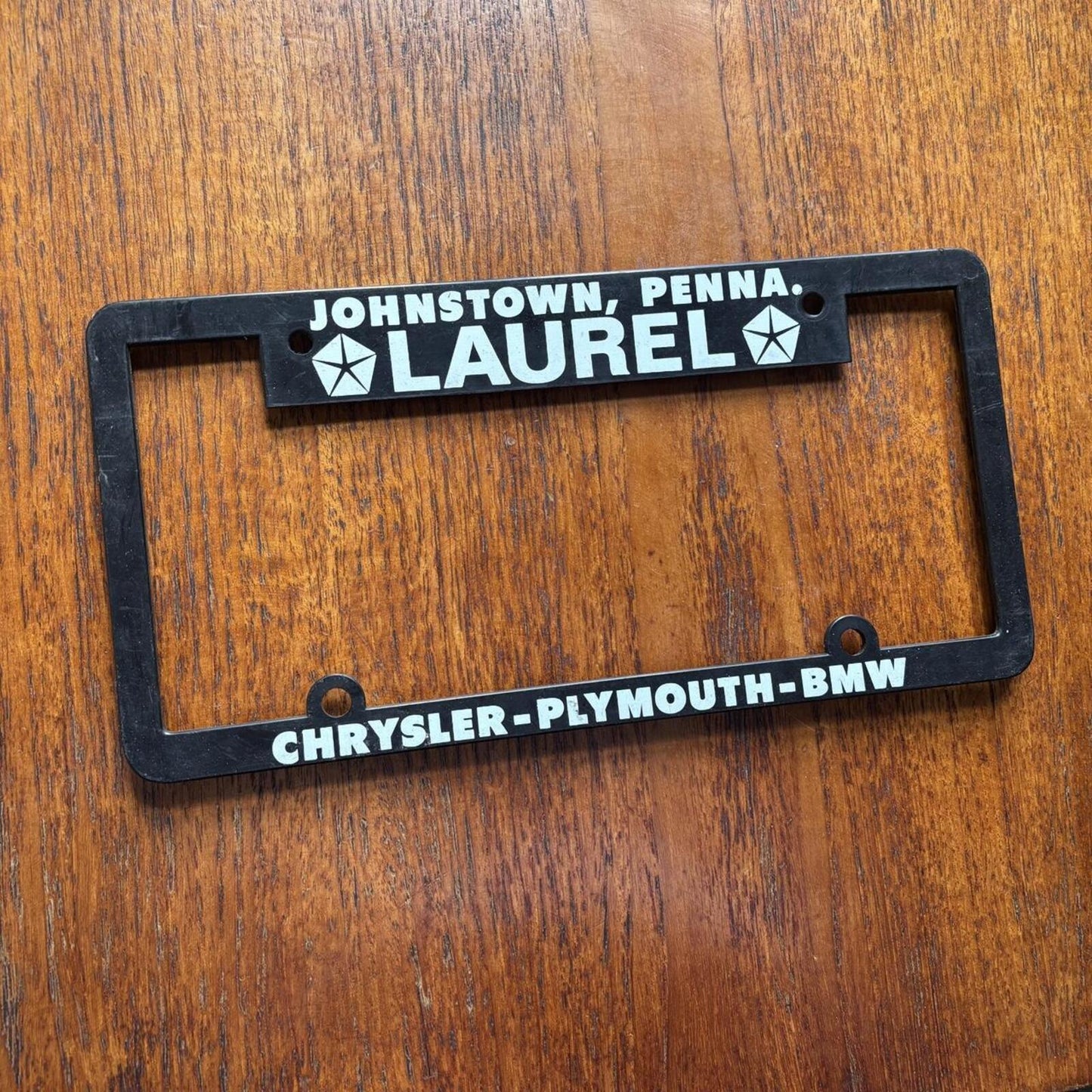 Vintage 90s Laurel Chrysler BMW car dealership American license plate holder